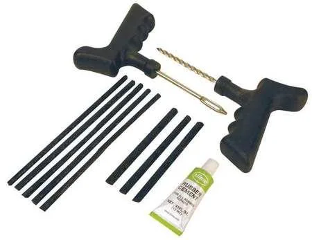 Transparent case holding an 11-piece tire plug kit with pistol-grip tools, rubber cement tube and black tire strings