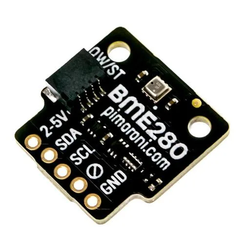 Small green circuit board with silver sensor chip and multiple pin headers