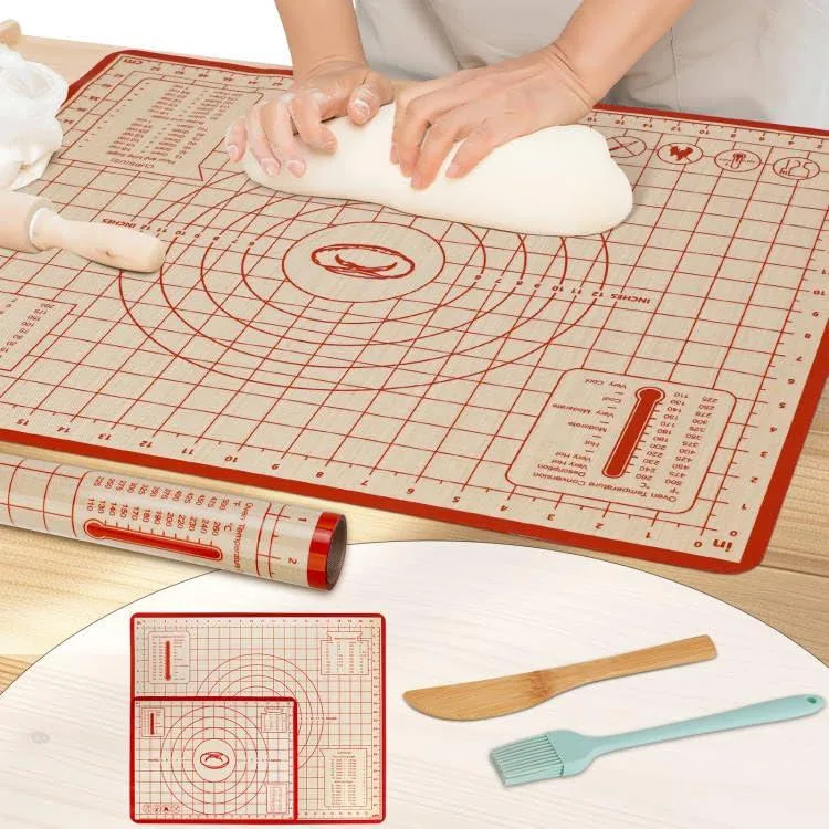 Two red silicone baking mats, large and small, with measurement markings