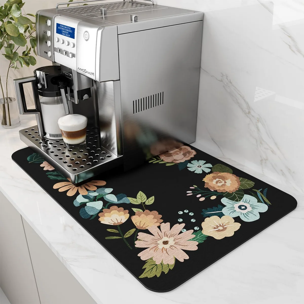 Rectangular black floral coffee mat with rubber backing, 12 by 19 inches