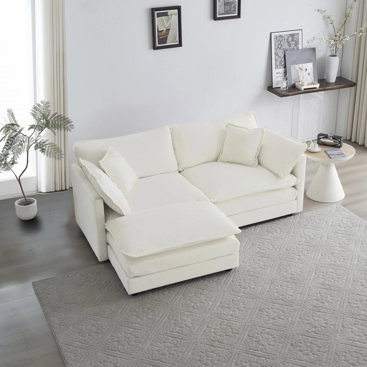 White chenille two-seater L-shaped sofa with matching ottoman and five scatter cushions