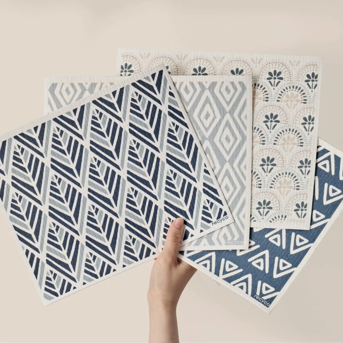 Four white rectangular cloths, 12 by 10 inches, flat stacked