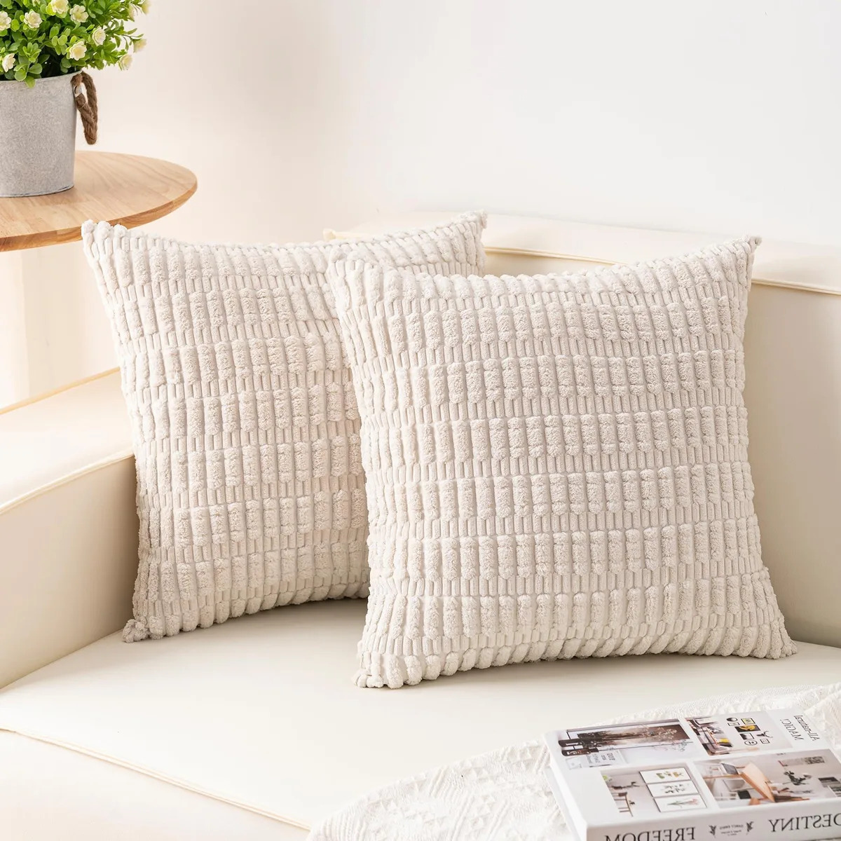Two cream corduroy pillow covers with striped texture and hidden zippers
