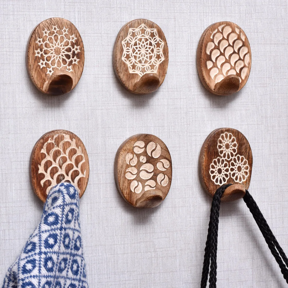 Six wooden adhesive wall hooks with twelve strips