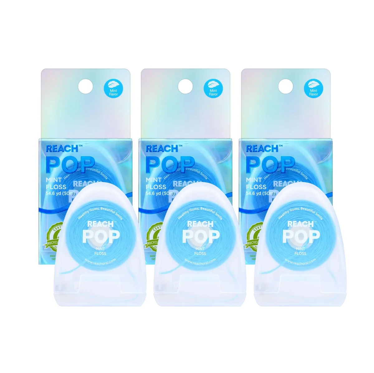 Three white mint floss dispensers in recycled packaging