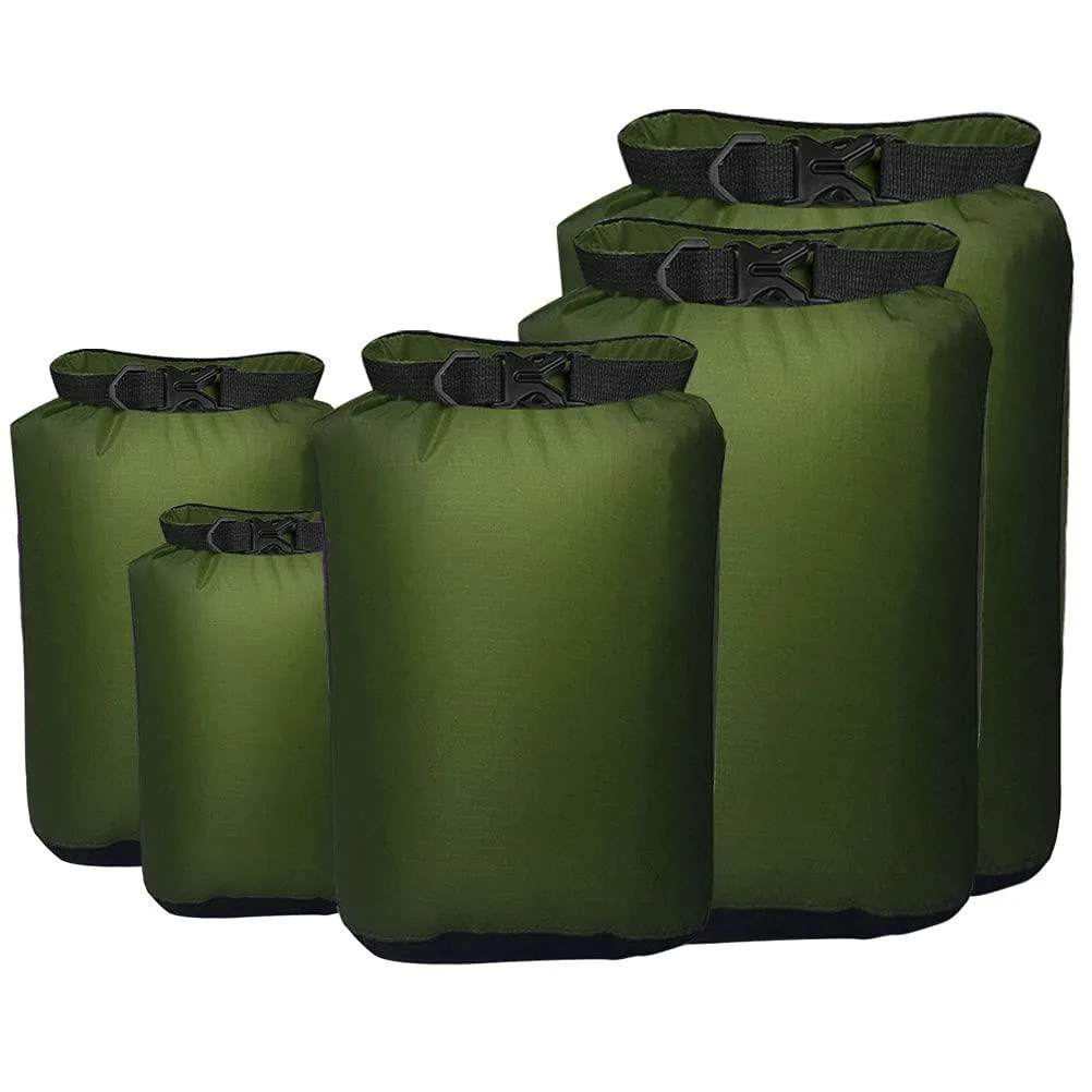 Five beige polyester dry sacks stacked by size, roll-top closures with buckles, D-rings attached