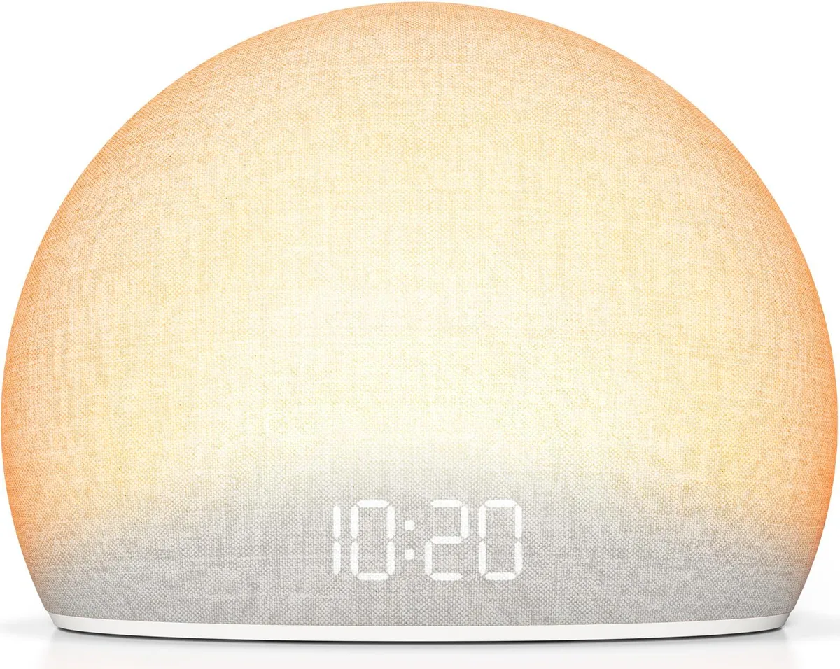 White rounded bedside clock with dimmable display and speaker grille