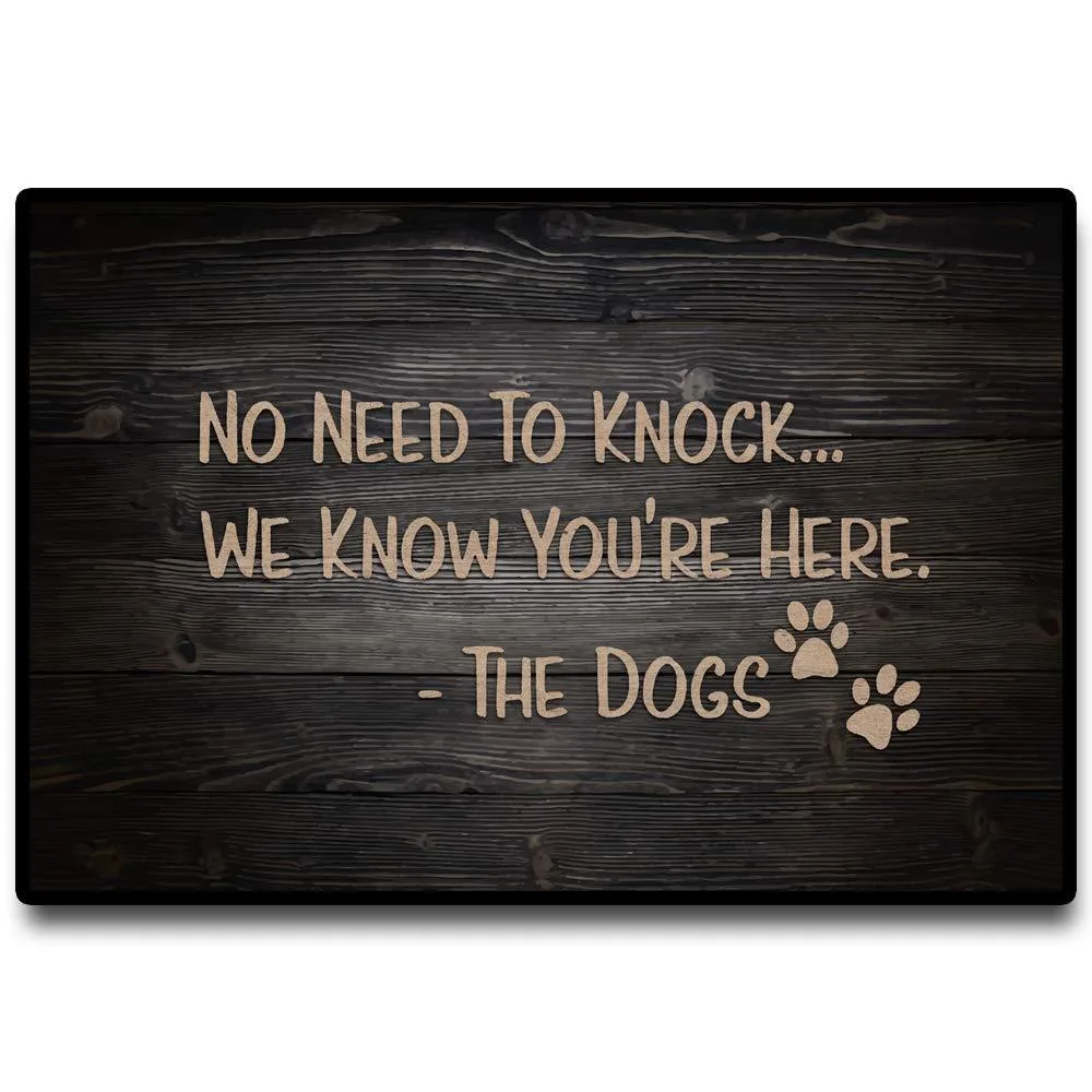 Black rectangular doormat with white lettering, rubber backing, 16 by 24 inches
