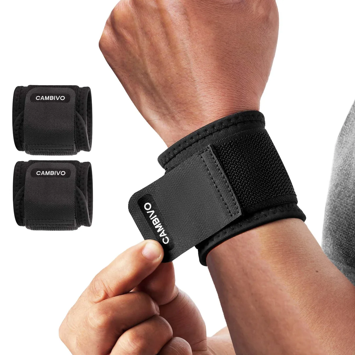 A pair of black neoprene wrist wraps with dual adjustable straps, laid flat