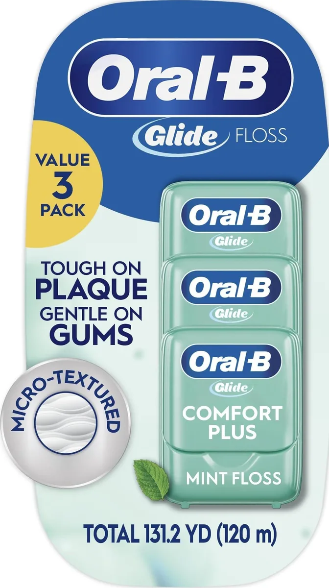 Three mint floss dispensers in white packaging with blue accents