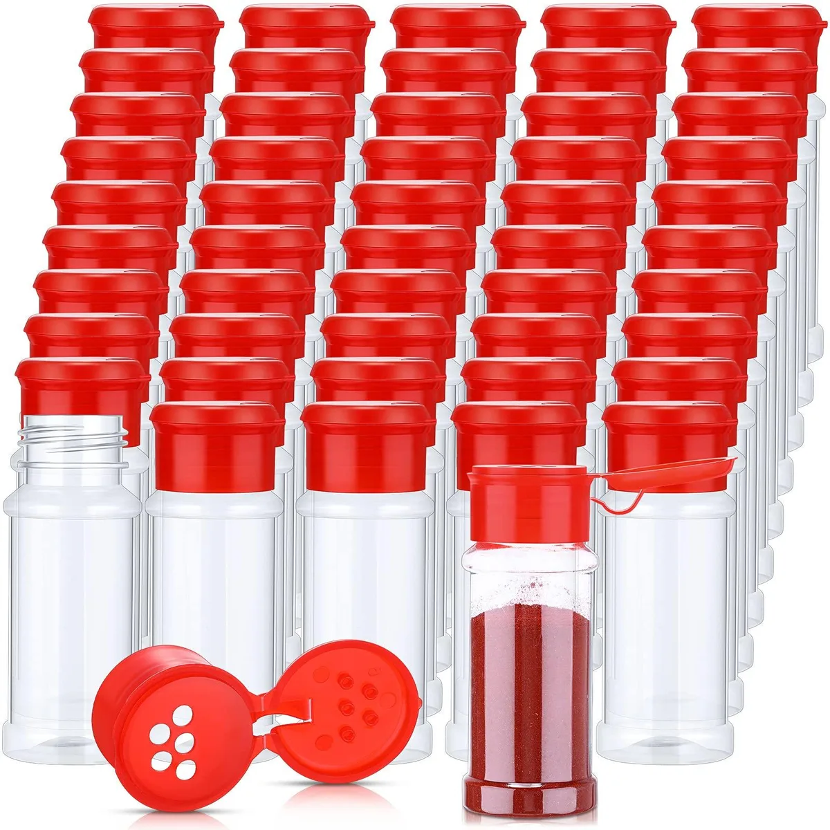 Fifty clear cylindrical jars with red flip-top shaker lids standing in a grid