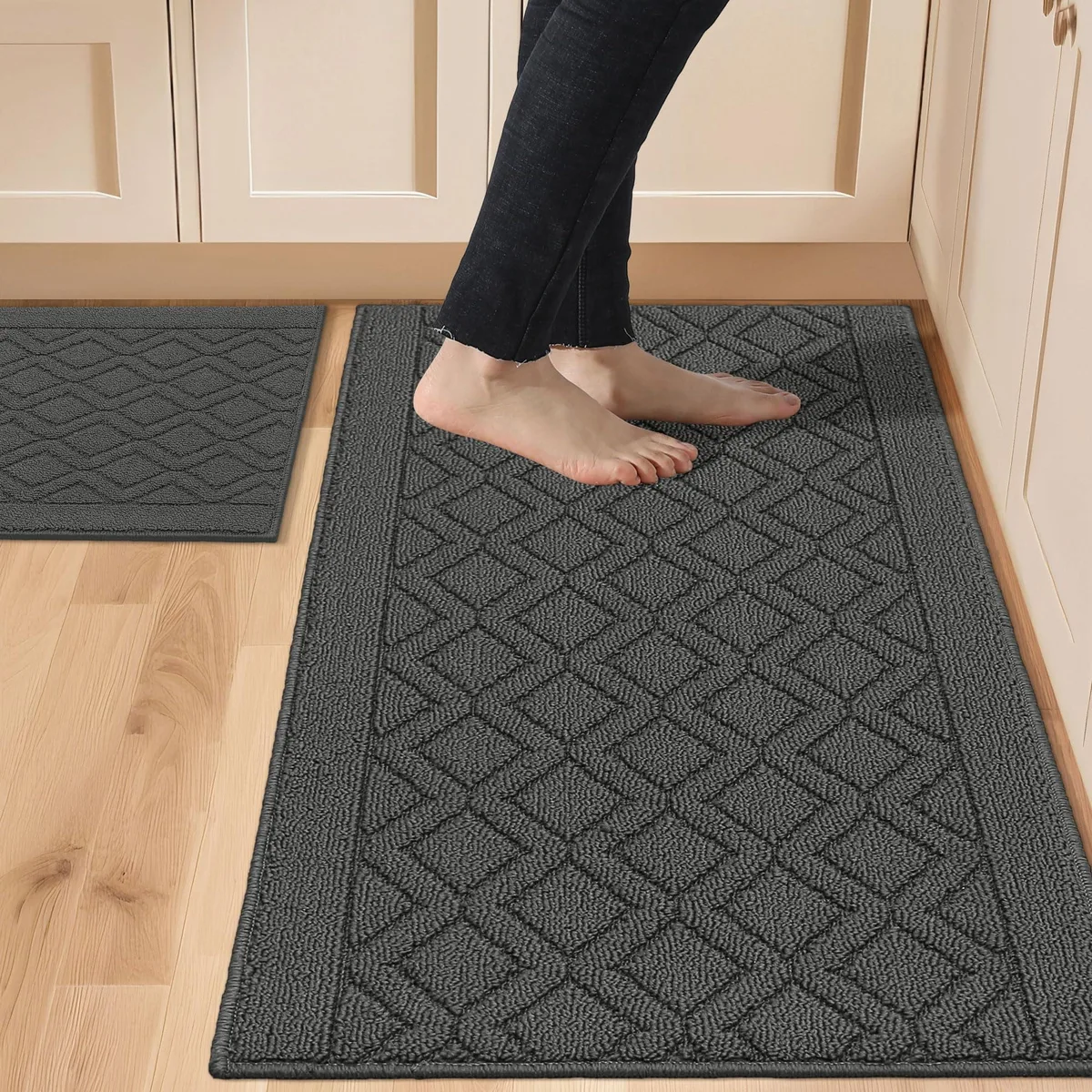 Two grey rectangular polypropylene rugs, 20 by 30 and 20 by 48 inches, flat-woven with a low pile