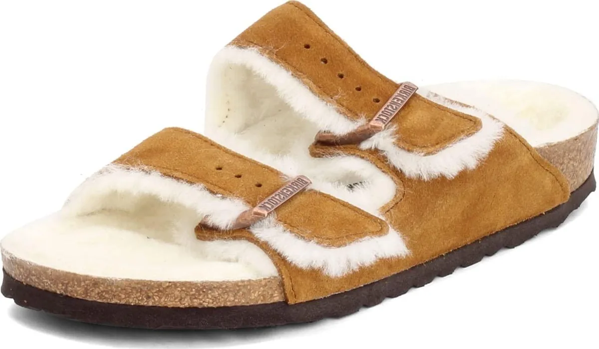 Brown leather sandal with shearling lining and two adjustable buckle straps on a cork footbed with rubber sole