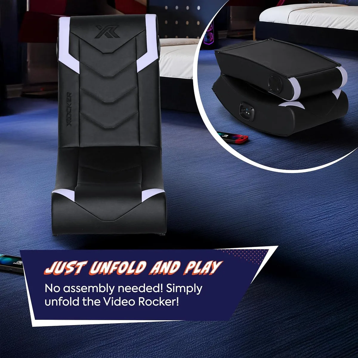 Black and silver floor rocker gaming chair with headrest speakers, folded view showing compact shape