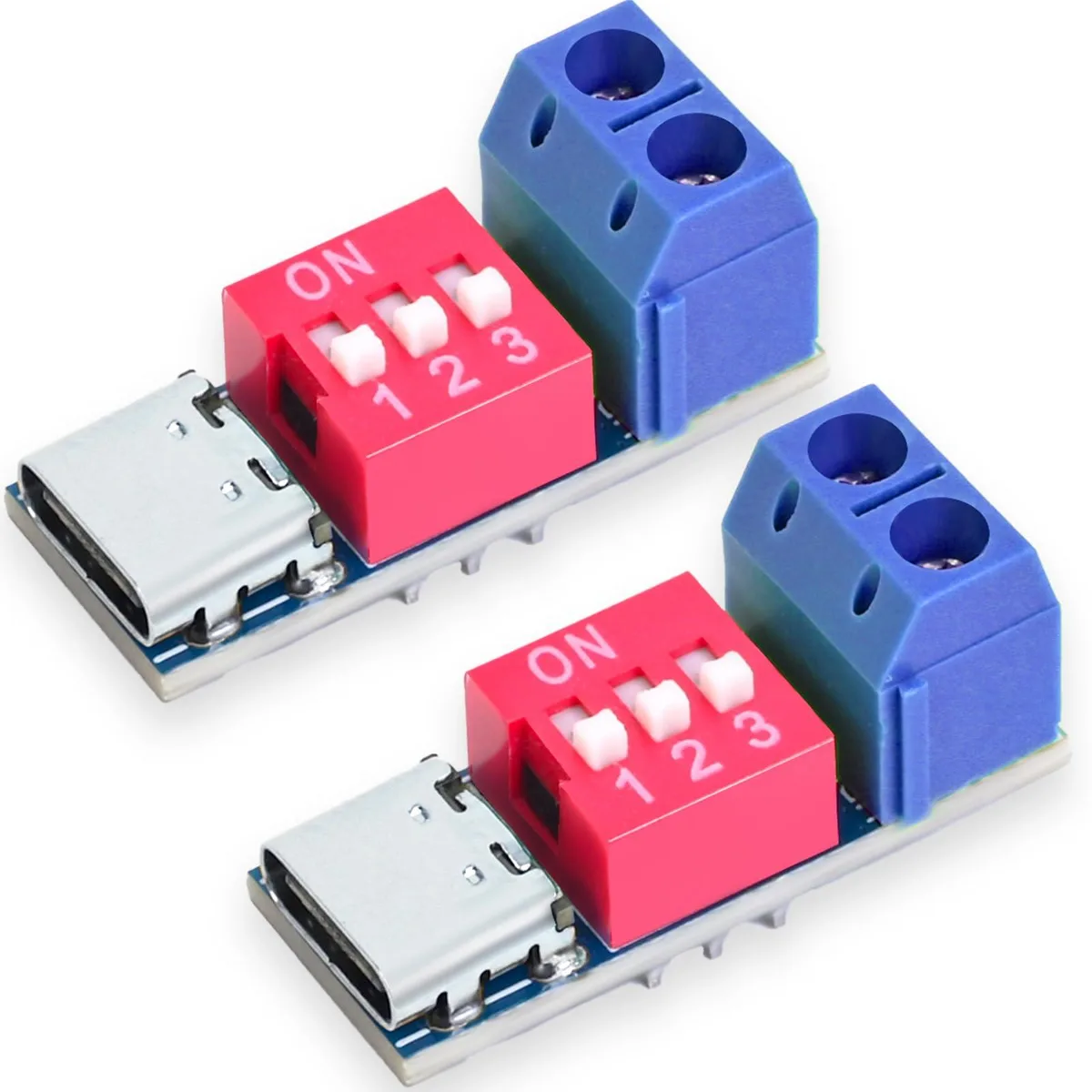 Two small green circuit boards with USB-C connectors and DIP switches