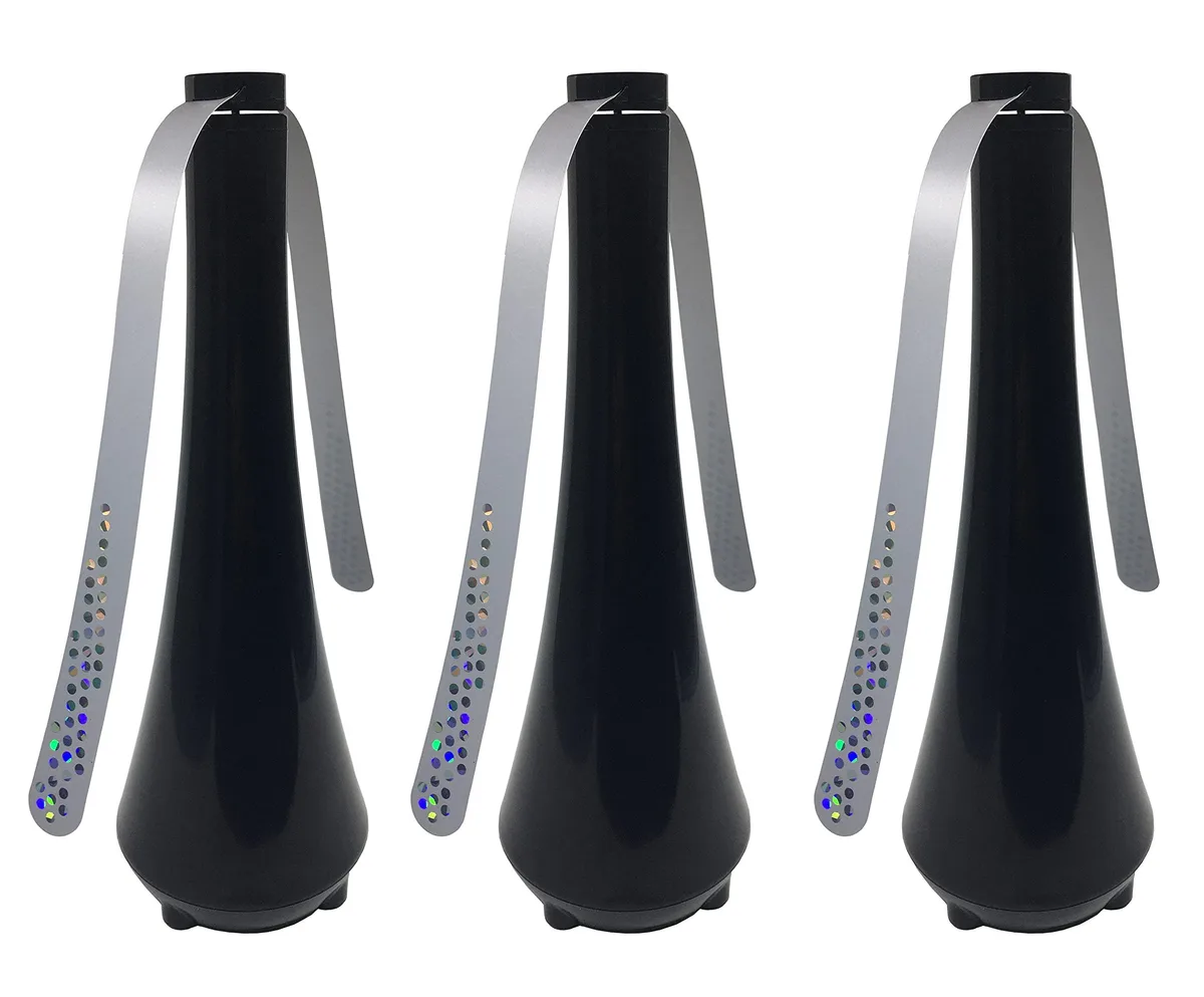 Three glossy black table fans with holographic blades, freestanding on a surface