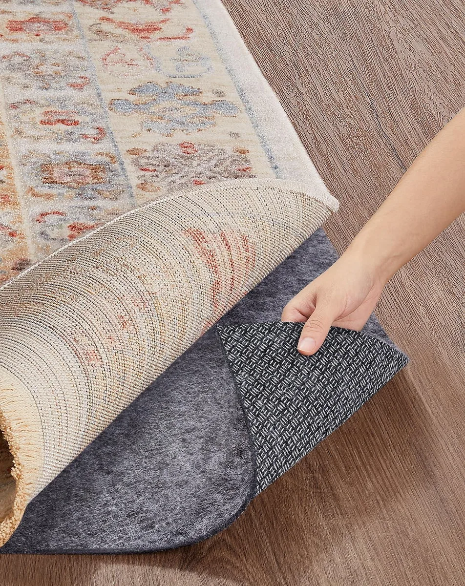 Grey rectangular rug pad with felt surface and silicone backing, 2 by 3 feet, one-eighth inch thick