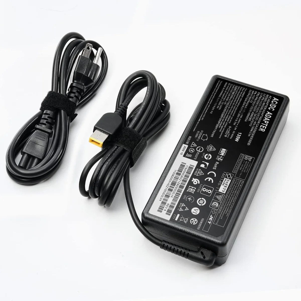 Black rectangular laptop charger with slim tip connector and detachable cable