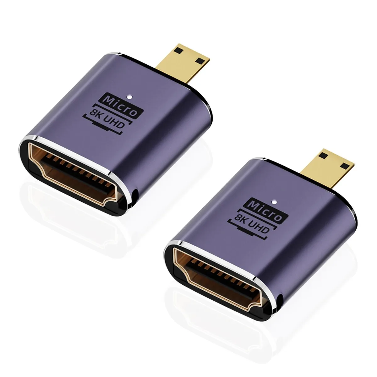 Two small purple adapters with micro HDMI male and HDMI female ports, aluminium finish