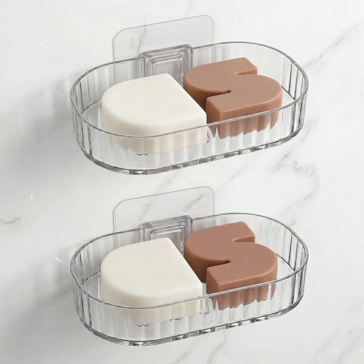 Two white plastic soap holders with slotted bases for drainage, wall-mounted or free-standing