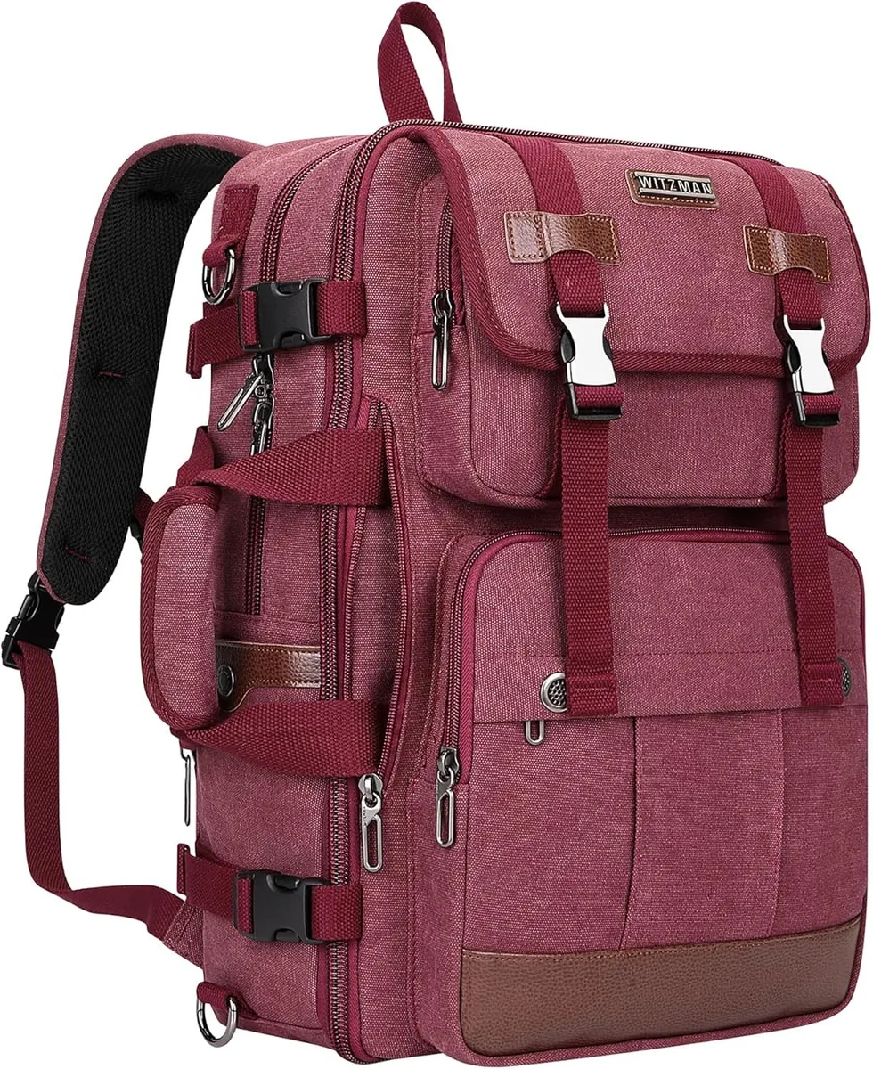 Red canvas travel backpack with leather trim, expandable main compartment and trolley sleeve