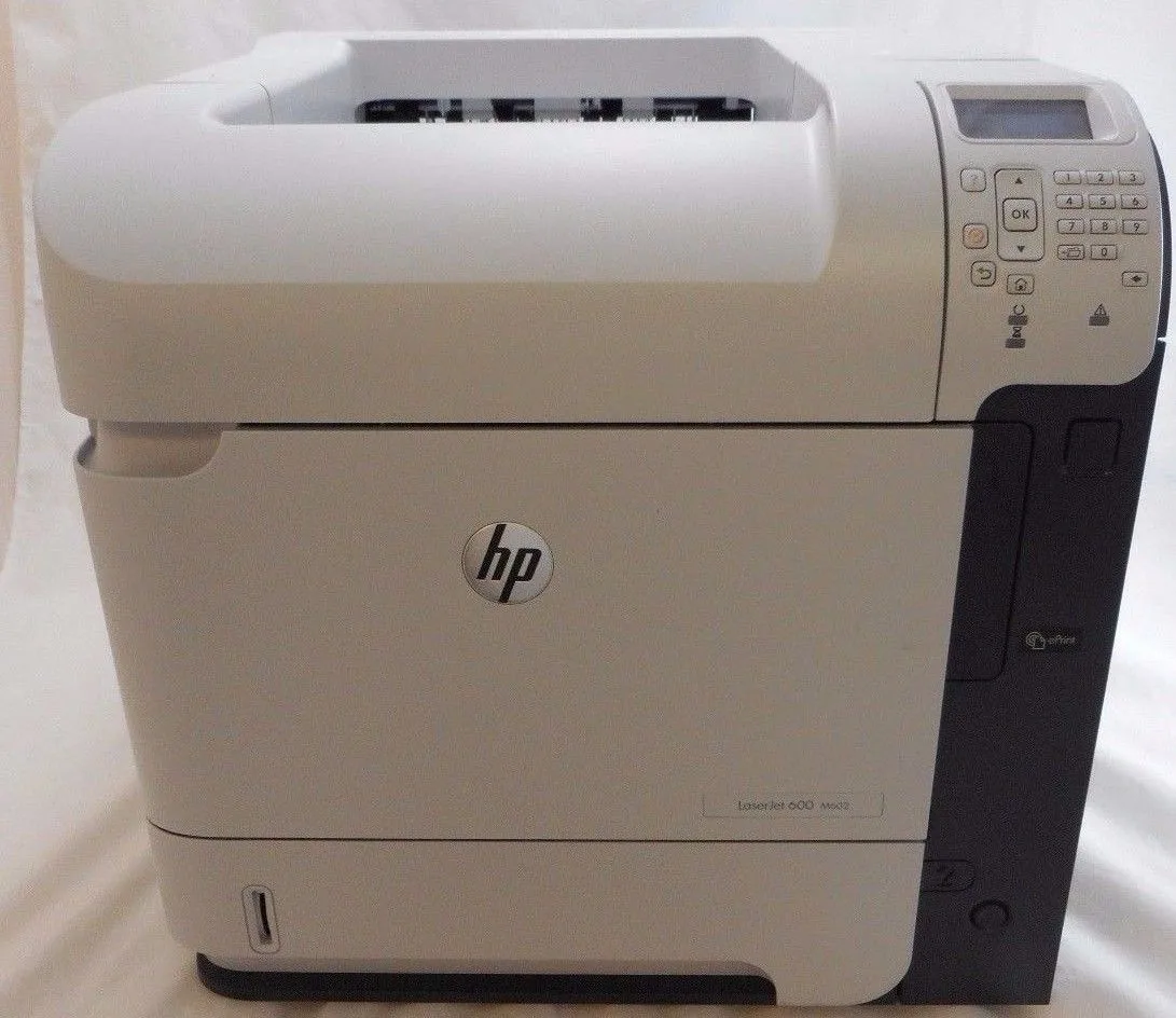 White rectangular office laser printer with control panel and paper trays