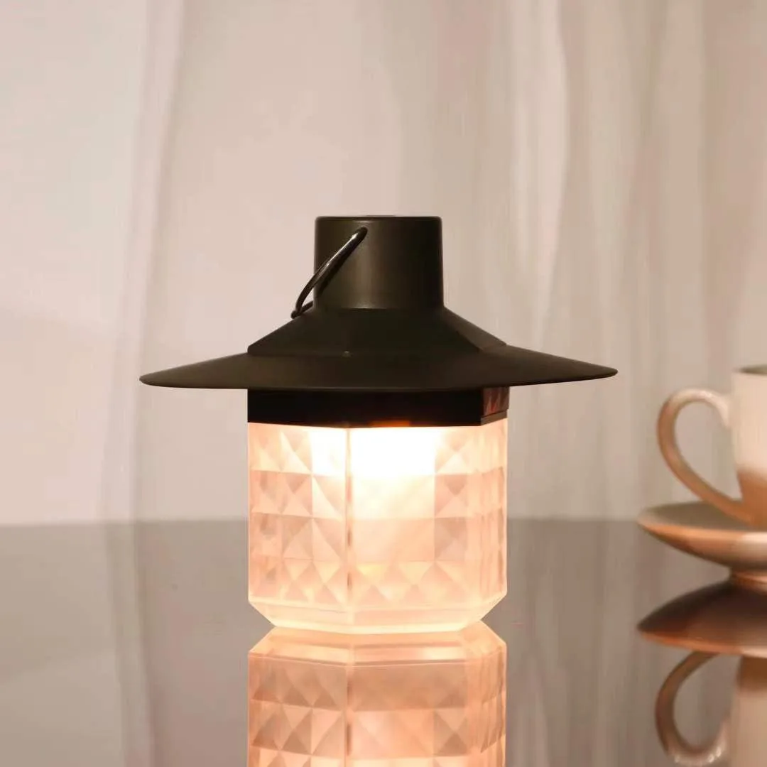 Black cylindrical LED lantern, compact 5.5 by 3.2 inch form, matte finish, single button control