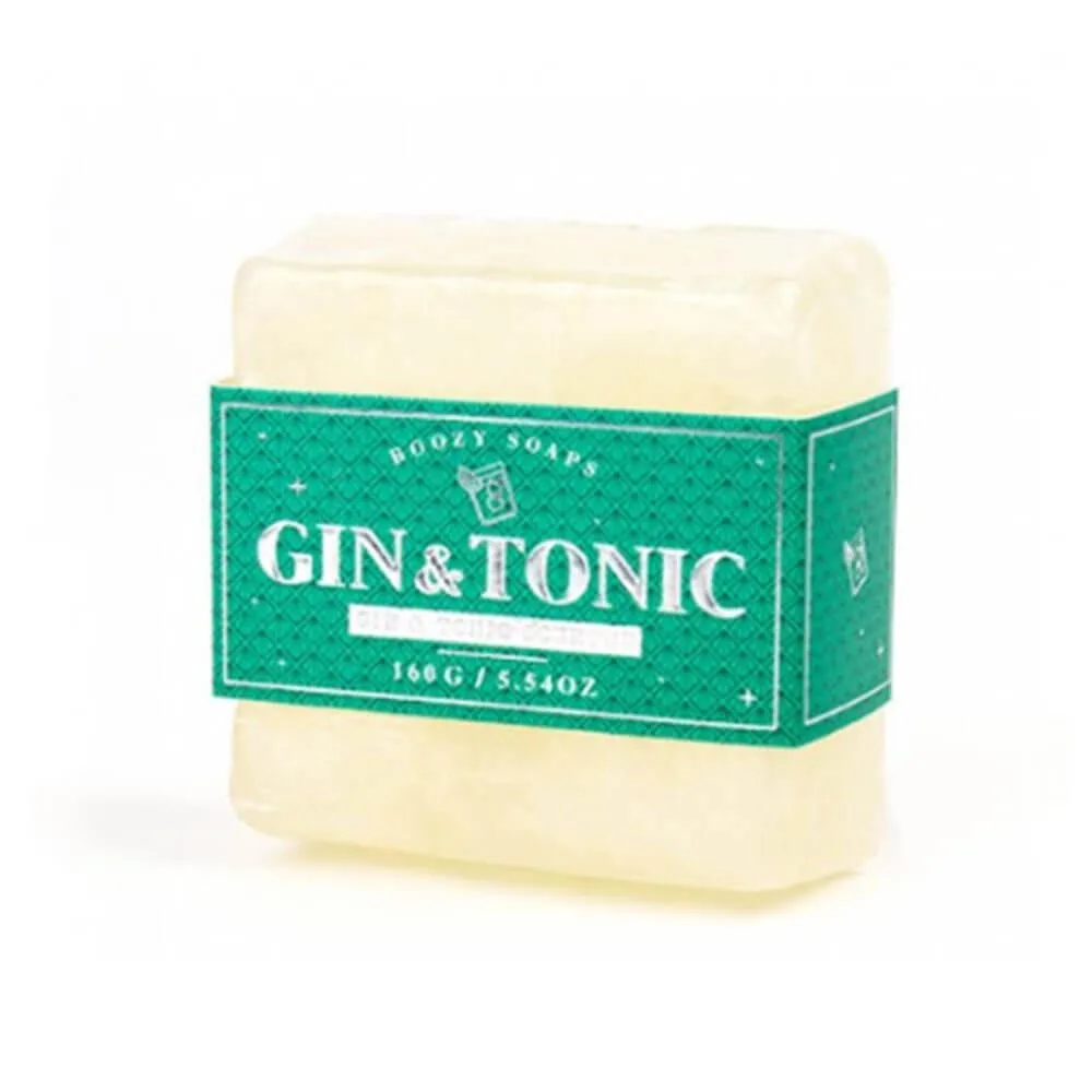 Rectangular bar of pale green soap with botanical specks and a gin-and-tonic label