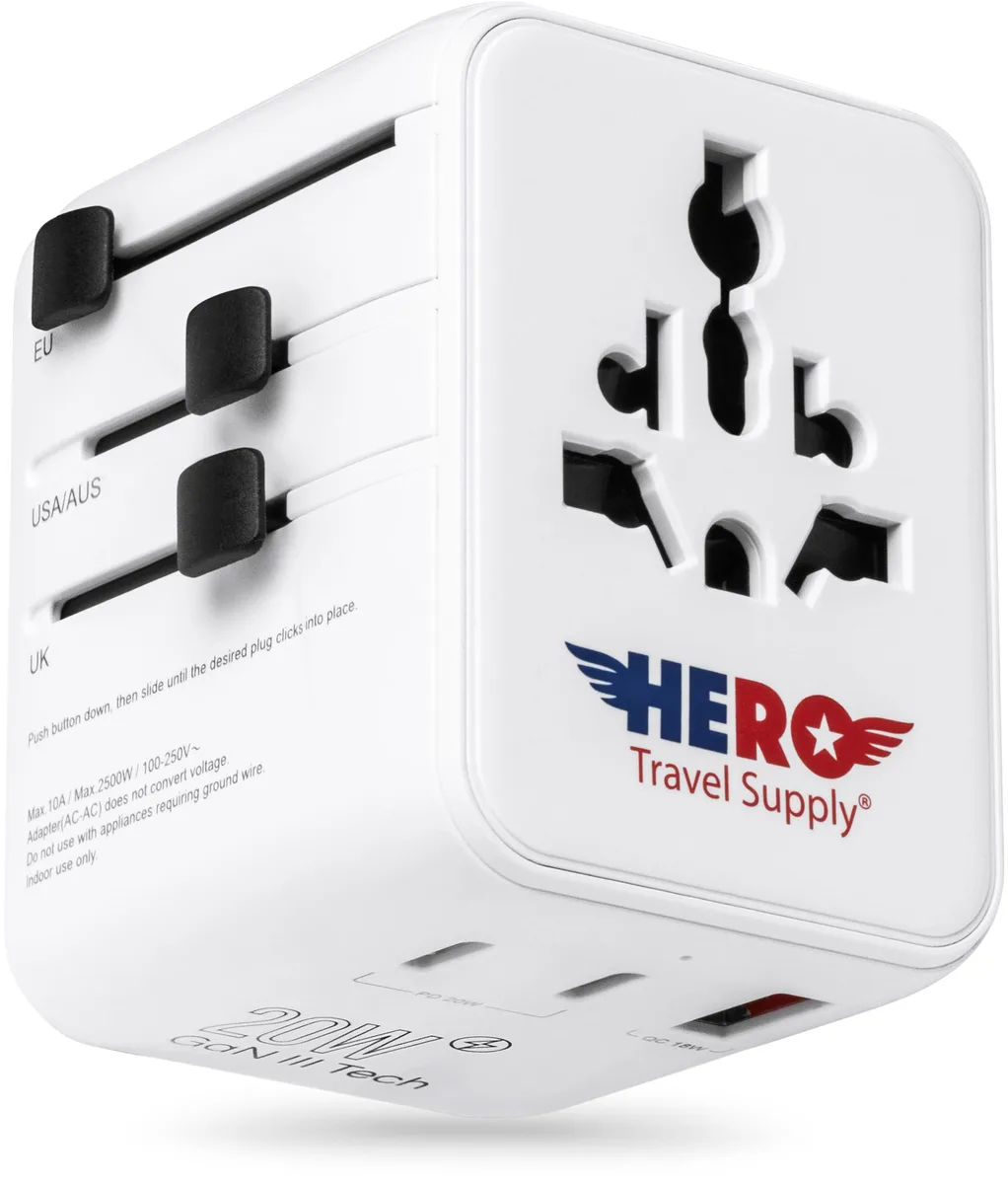 White cube travel adapter with retractable plugs and USB ports