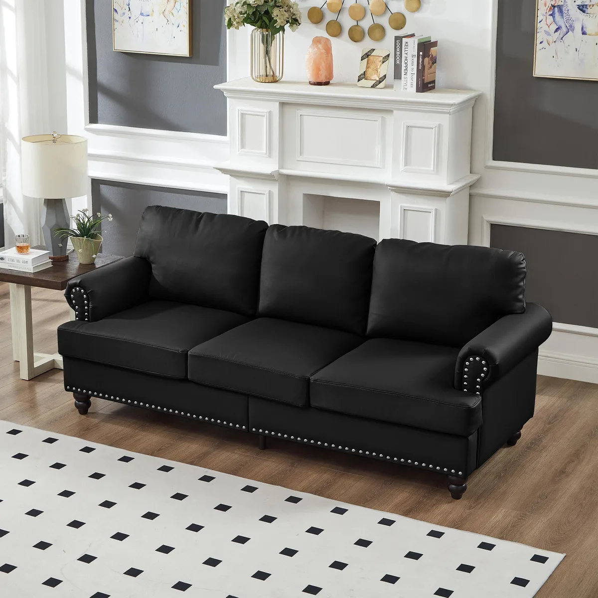 Black 83-inch modern classic sofa with silver nailhead trim, rolled arms, wooden legs and removable leather cushions