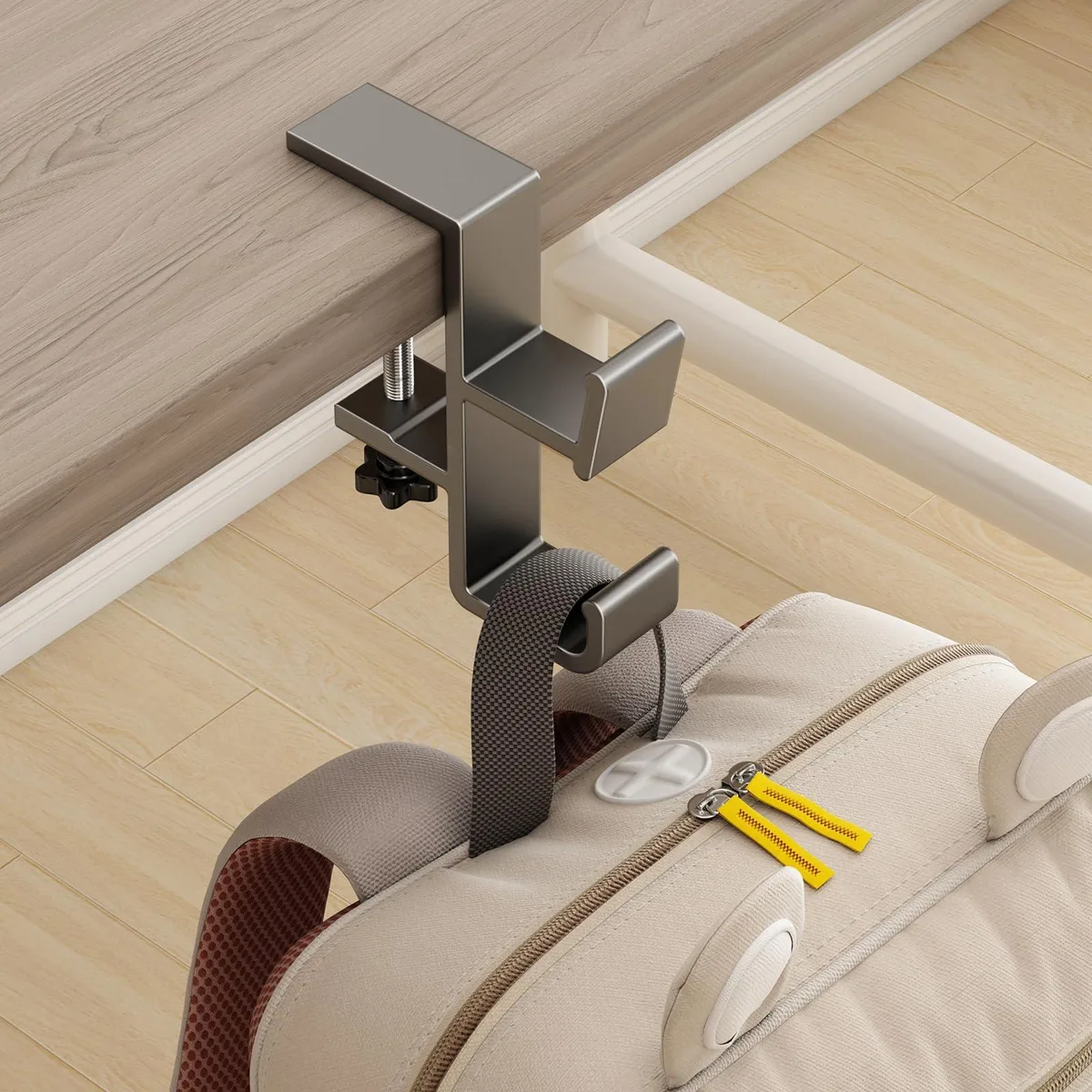 Gray aluminium under-desk hook with two arms and a protective sponge pad