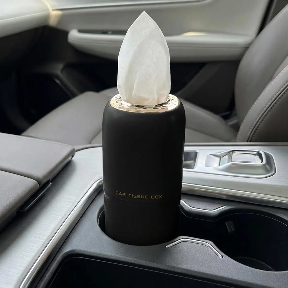 Black cylindrical ABS tissue holder, 6.81 by 2.52 inches, smooth matte finish