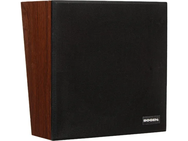 Square walnut-finished wooden box with black cloth grille, angled front, recessed volume knob