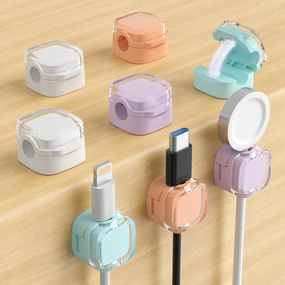 Eight small square plastic clips in translucent multicolour finish, each with a magnetic top and adhesive base