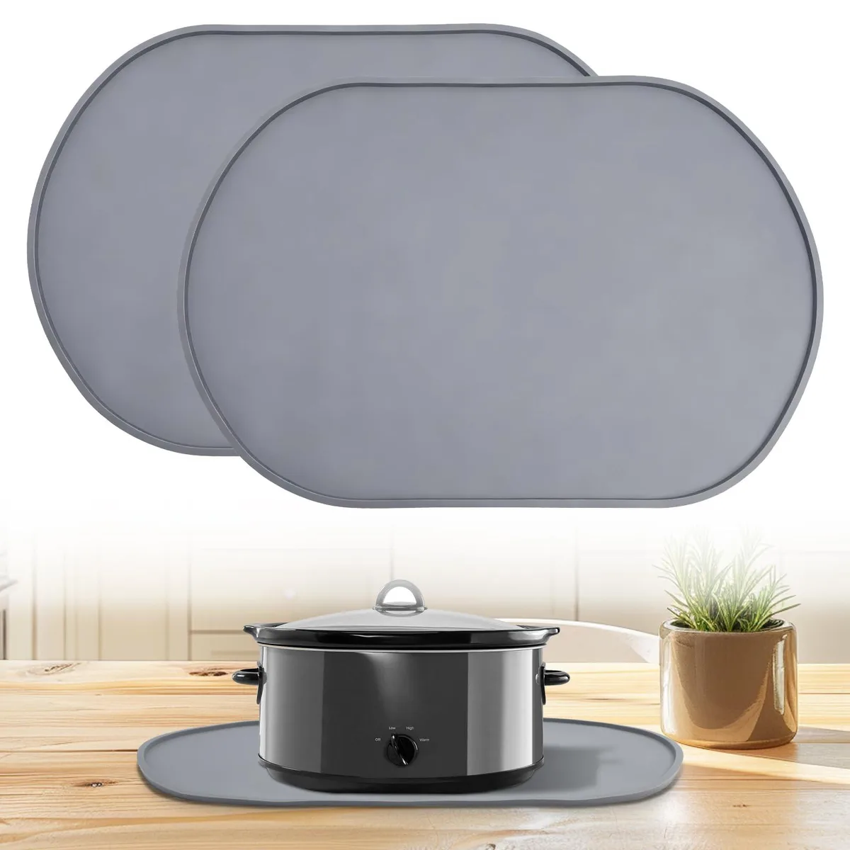 Two oval grey silicone mats, thickened, non-slip, rolled for storage