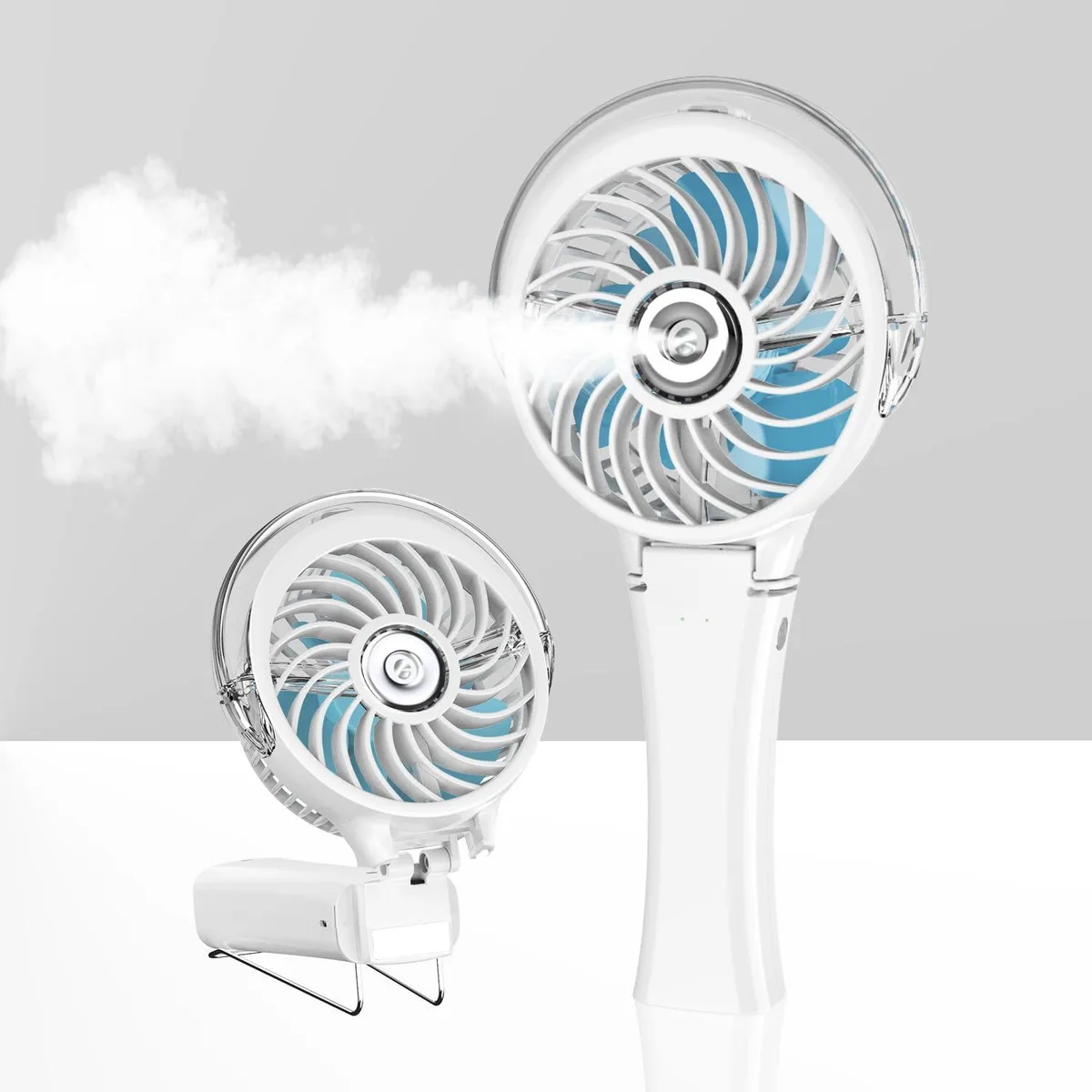 White handheld misting fan with silver blades and polished finish